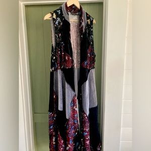 Pyramid brand long vest size S, but fits more like a Medium. Never worn.